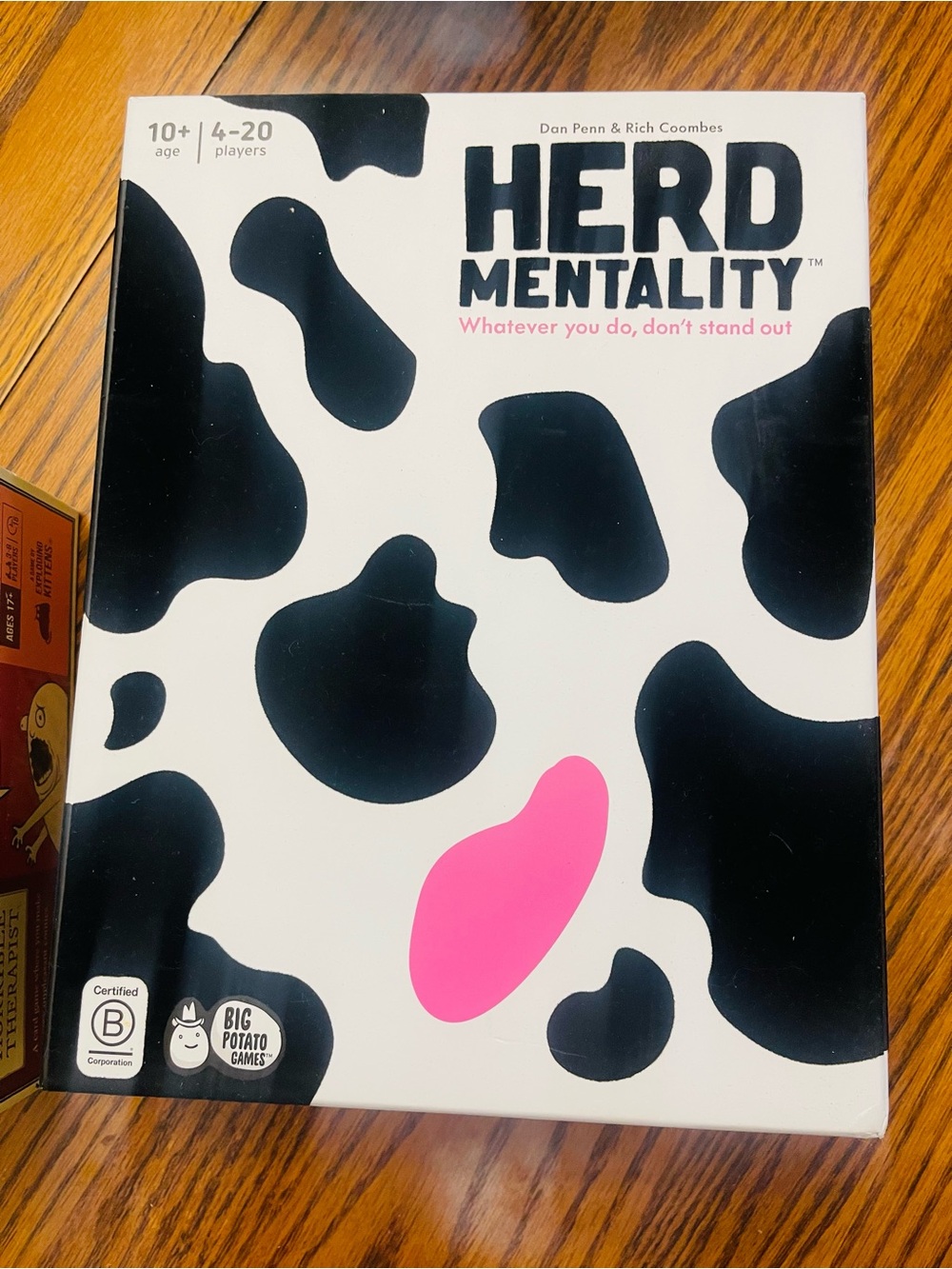 Herd Mentality Board Game by — White & Black with Pink Accent
